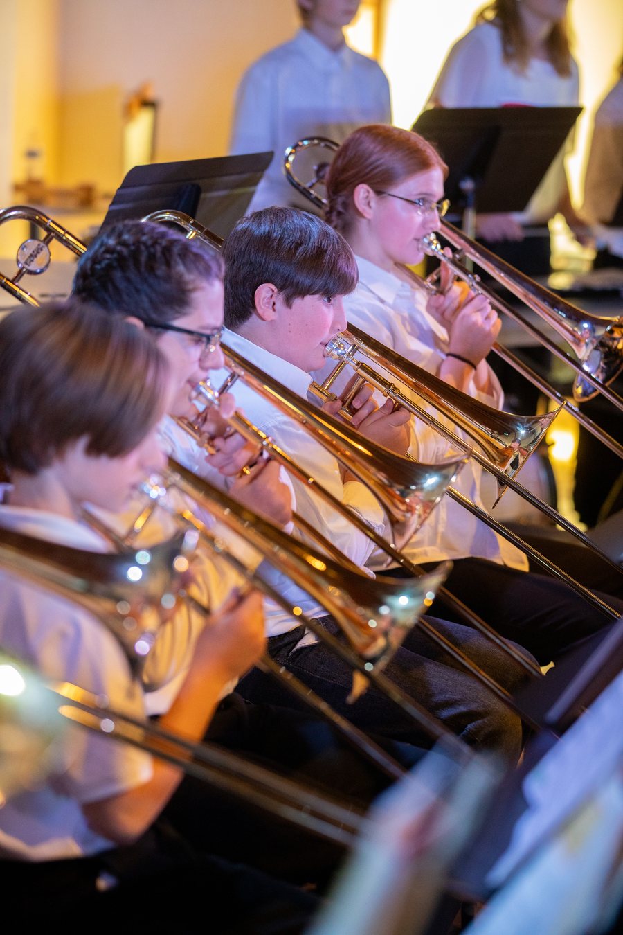 Trombone students playing in band